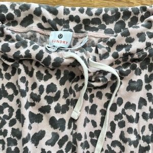 Light pink swetpants with gray cheetah print never used